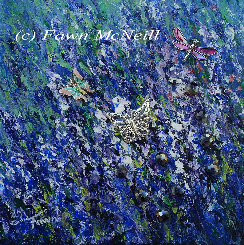 A mixed media painting of lavender flowers have charms of butterflies and a dragonfly added, as well as beads for sparkle.